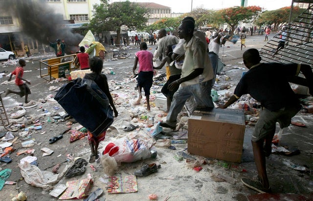 Residents capitalized on the breakdown of law and order by helping themselves to whatever they could find, including the crops of their neighbors.  Here, residents emptied shops in downtown Mombasa. © 2007 Reuters
